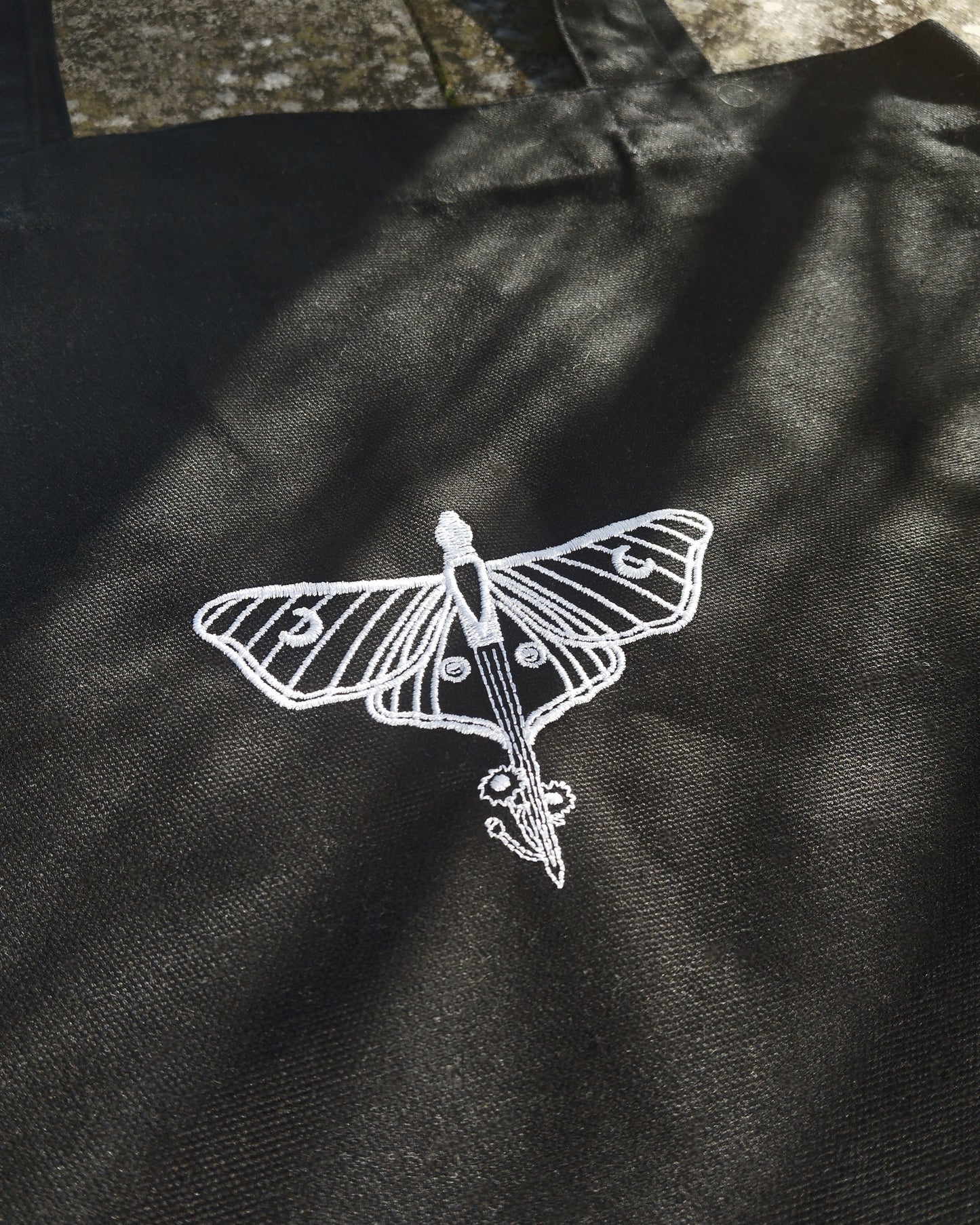 The Moonlight & Malice Embroidered Moth Tote Bag in Black