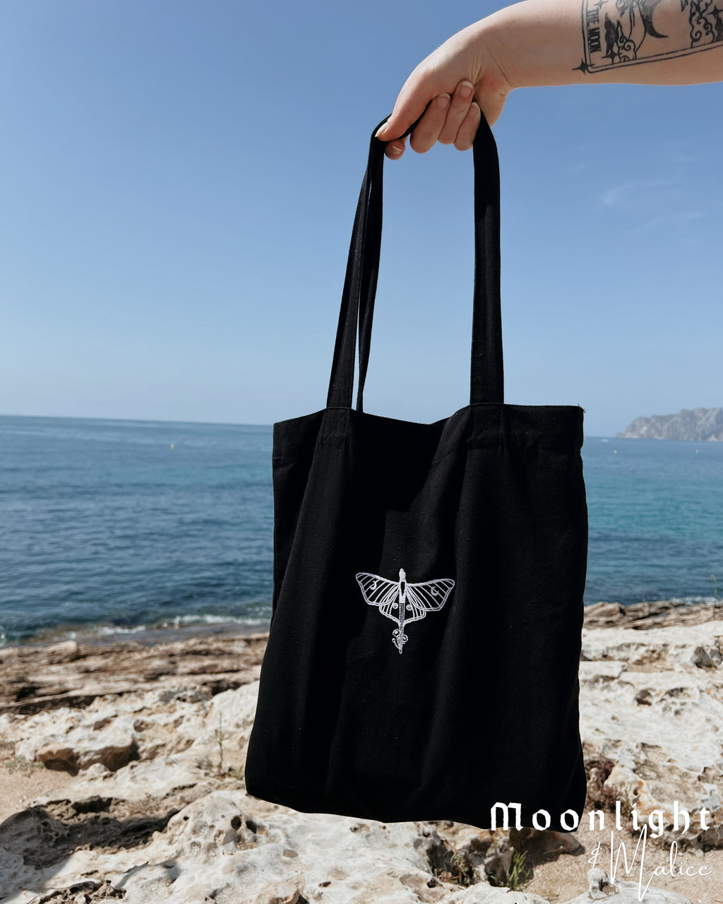 The Moonlight & Malice Embroidered Moth Tote Bag in Black